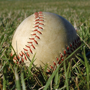 bigstockphoto_Softball_In_The_Grass_2157531