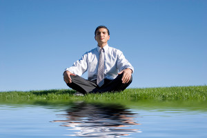 bigstock_Businessman_meditating_on_gree_11897501